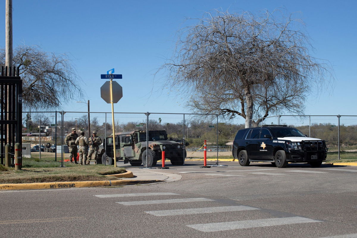 <i>Kaylee Greenlee Beal/Reuters</i><br/>Texas National Guard troops control who enters and exits Shelby Park at the US-Mexico border in Eagle Pass