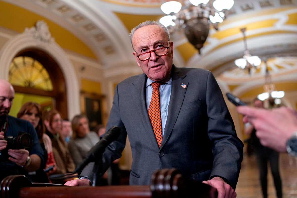 <i>J. Scott Applewhite/AP</i><br/>Senate Majority Leader Chuck Schumer meets with reporters at Capitol in Washington on December 19. Just five days remain until a key government funding deadline.