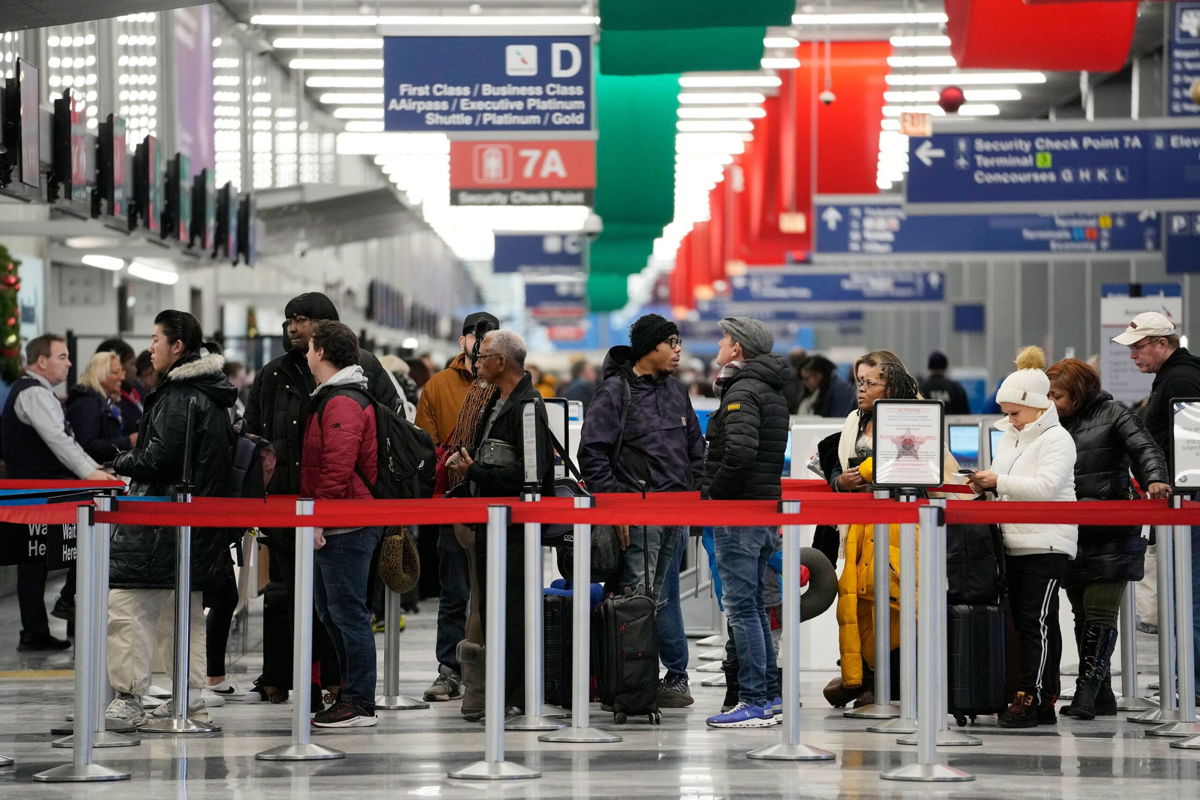 <i>Nam Y. Huh/AP</i><br/>Travelers wait to go through security check point at the O'Hare International Airport in Chicago
