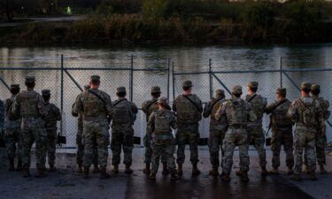 National Guard soldiers stand guard on January 12 on the banks of the Rio Grande at Shelby Park in Eagle Pass