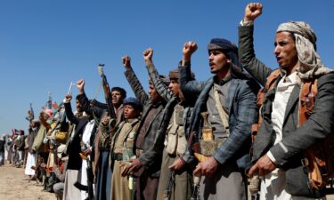 Houthi fighters and tribesmen stage a rally against the U.S. and the U.K. strikes on Houthi-run military sites near Sanaa