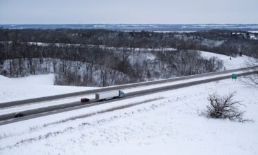 Vehicles travel the Interstate-80 highway during a winter storm on the day of the Iowa Caucus near Missouri Valley on January 15.