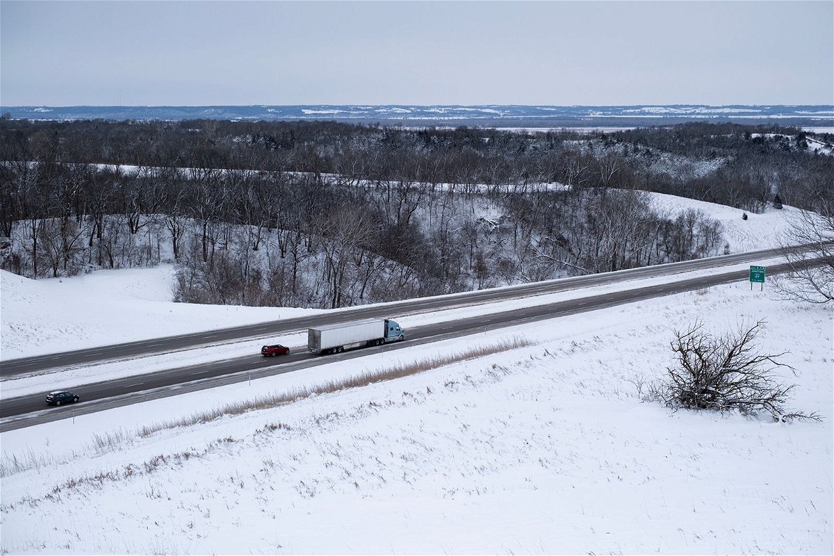 <i>Jim Vondruska/Bloomberg/Getty Images</i><br/>Vehicles travel the Interstate-80 highway during a winter storm on the day of the Iowa Caucus near Missouri Valley on January 15.