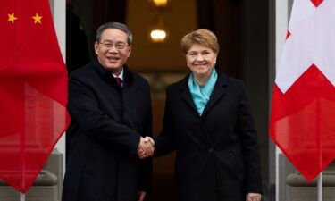 Swiss President Viola Amherd and Chinese Premier Li Qiang shake hands during an official visit in Kehrsatz near Bern