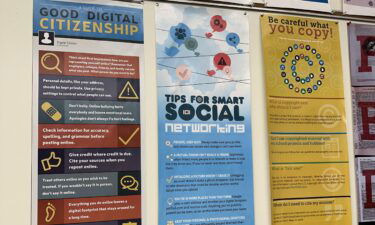 Media literacy posters hang at South Brunswick High School in New Jersey.