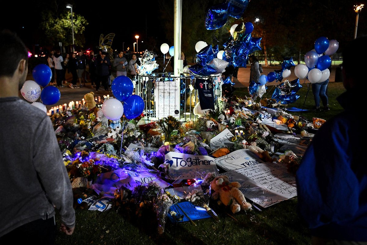 <i>Harrison Hill/USA Today</i><br/>Santa Clarita and Saugus High School students and alumni hold a vigil in November 2019 to honor those affected by a school shooting.