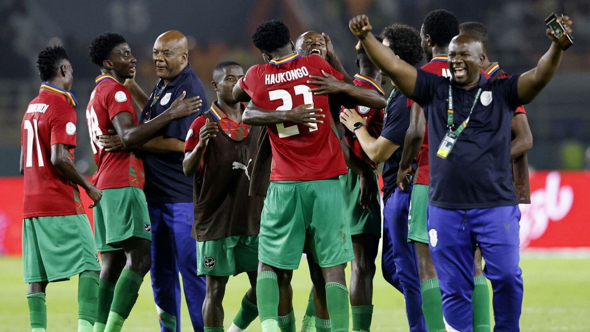 <i>Luc Gnago/Reuters</i><br/>Namibia's players celebrate the historic victory at the full time whistle.