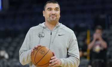 Dejan Milojevic smiles during an NBA preseason basketball game against the Denver Nuggets San Francisco