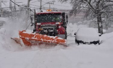 A snow plow clears the streets of heavy snow Thursday in Lackawanna