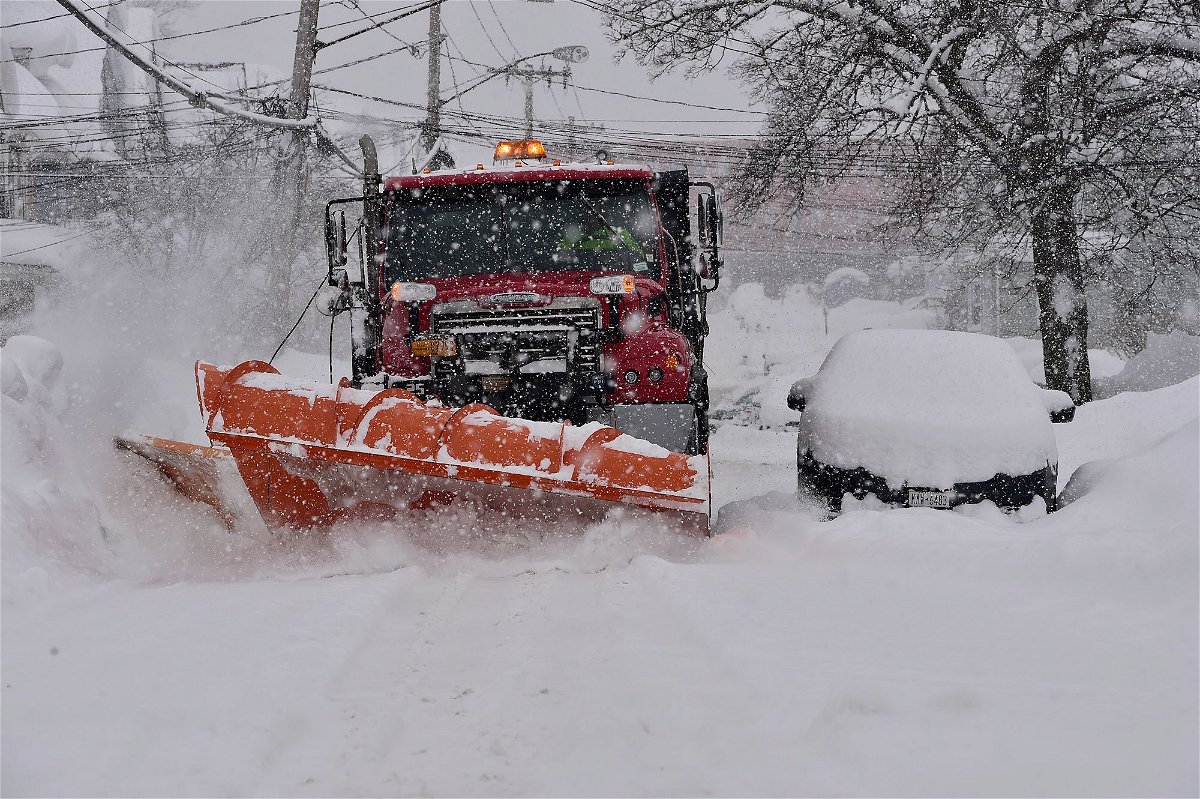 <i>John Normile/Getty Images</i><br/>A snow plow clears the streets of heavy snow Thursday in Lackawanna