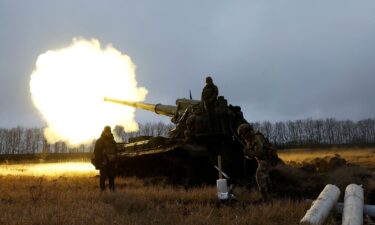 Ukrainian soldiers fighting Russia fire a projectile during intense shelling on the front line in Bakhmut