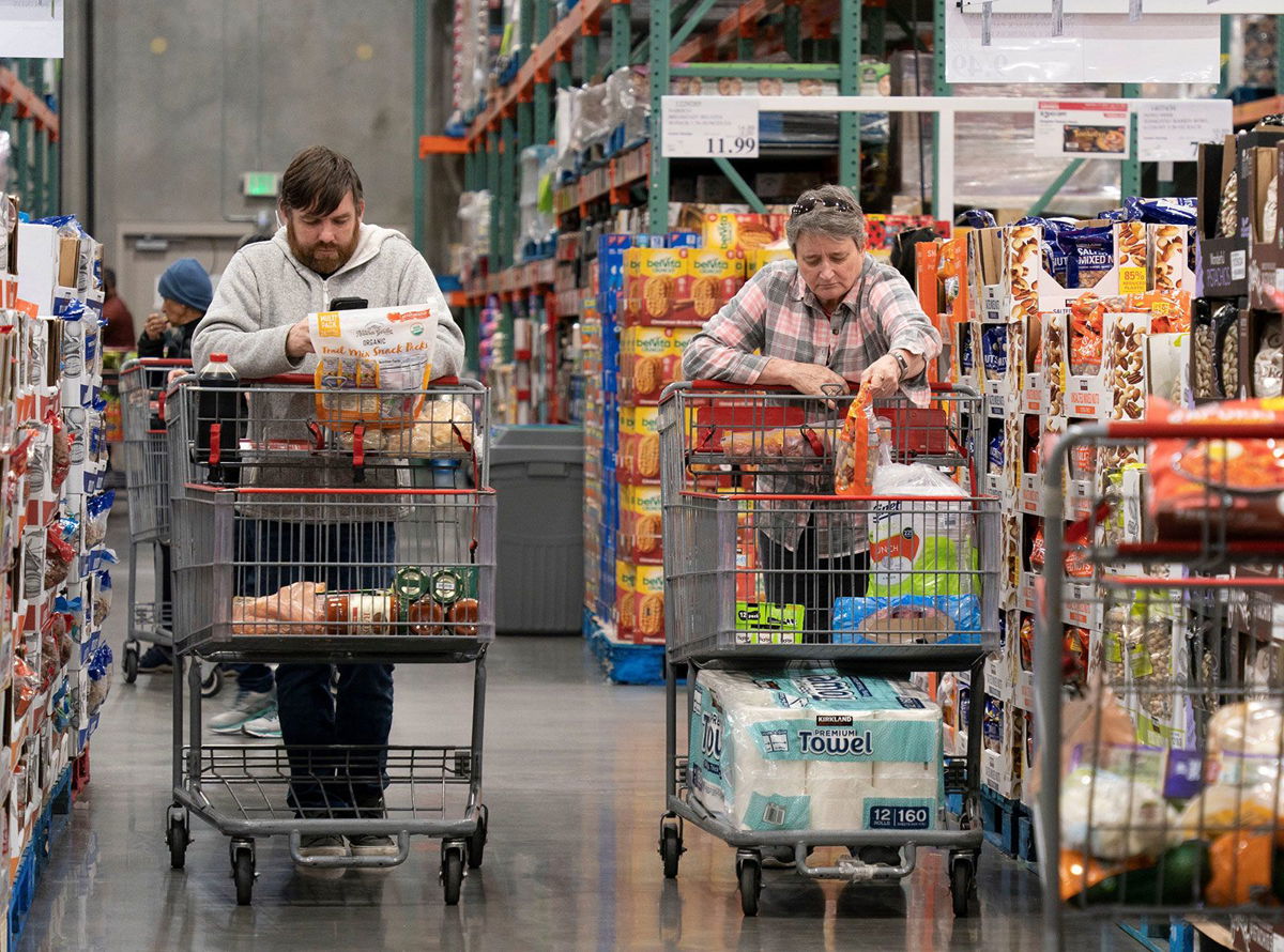<i>Li Jianguo/Xinhua/Getty Images</i><br/>People shop at a supermarket in Foster City