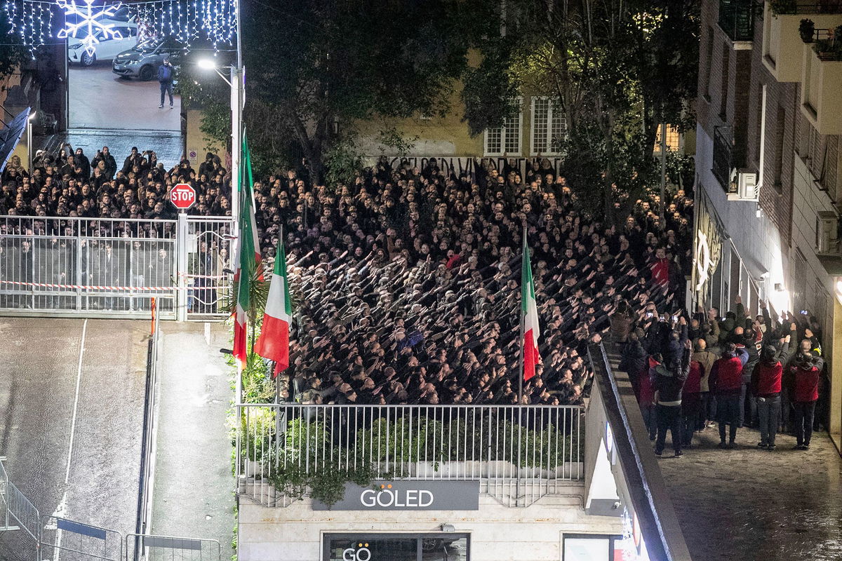 <i>Francesco Benvenuti/LaPresse/AP</i><br/>Some 150 people perform the banned fascist salute to commemorate the 1978 killing of two far-right militants in Rome