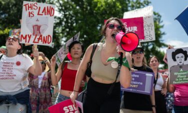 Abortion rights demonstrators rally to mark the first anniversary of the US Supreme Court ruling overturning Roe v. Wade in Washington