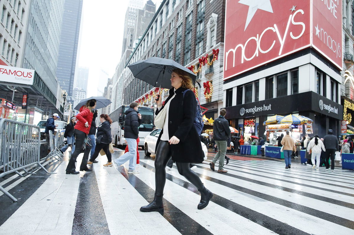 <i>Kena Betancur/VIEWpress/Corbis/Getty Images</i><br/>People cross the street outside Macy's Herald Square store in December 2023. Macy’s has rejected a $5.8 billion offer to take the 165-year-old retailer private.