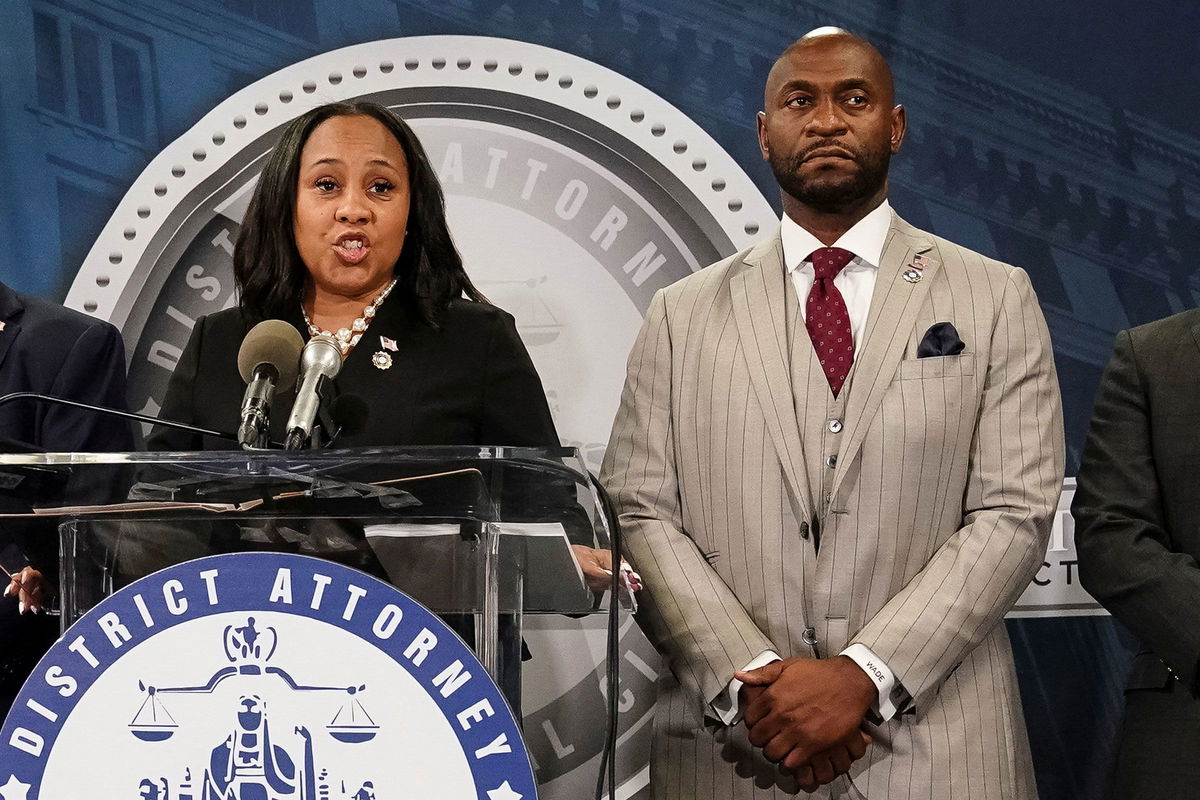 <i>Elijah Nouvelage/Reuters/File</i><br/>Fulton County District Attorney Fani Willis speaks at a news conference next to prosecutor Nathan Wade in August 2023.