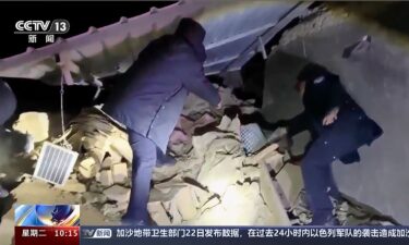 Rescuers search for survivors under the rubble after an earthquake struck China's far western region of Xinjiang on January 23.