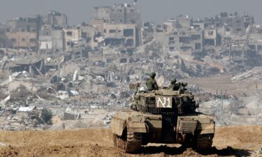 An Israeli tank operates along the border with the Gaza Strip on January 19. Twenty-one Israeli soldiers were killed during fighting in southern Gaza on January 22