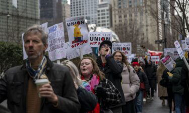 Unionized staff at Condé Nast walk the picket line during a 24 hour walk out amid layoff announcement in front of the Condé Nast offices at One World Trade Center in New York City on January 23. Conde Nast is merging the popular digital music publication Pitchfork with the men's magazine GQ