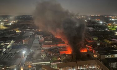 Smoke rises from the deadly fire in Johannesburg