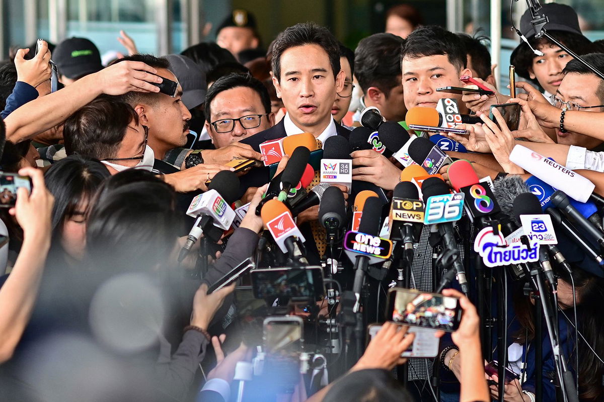 <i>Manan Vatsyayana/AFP/Getty Images</i><br/>A supporter of former Thai prime ministerial candidate and ex-Move Forward Party leader Pita Limjaroenrat celebrates outside the Constitutional Court in Bangkok on January 24 after the court decided to reinstate him as a lawmaker.