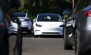 Brand new Tesla cars sit parked at a Tesla dealership on October 18