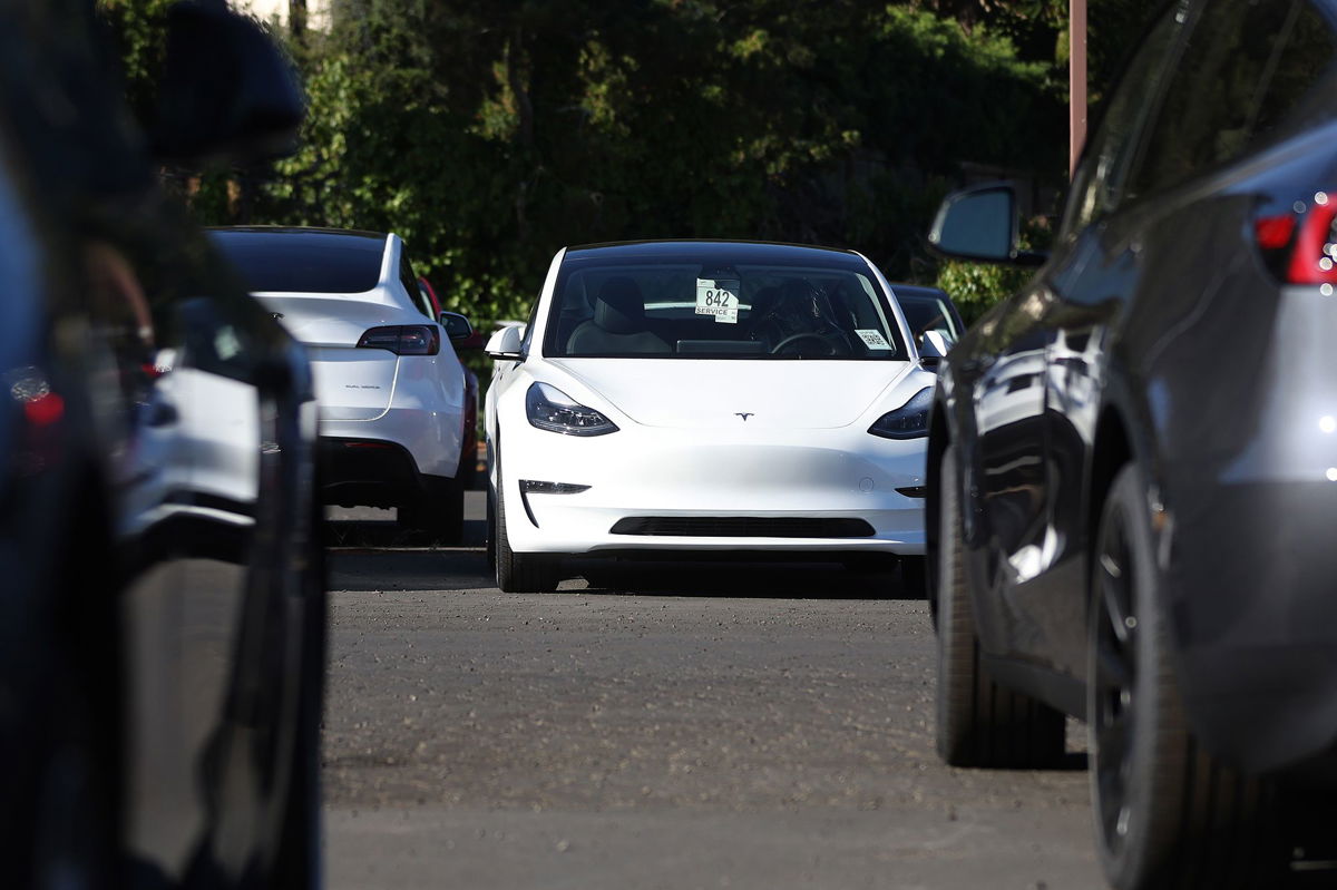 <i>Justin Sullivan/Getty Images</i><br/>Brand new Tesla cars sit parked at a Tesla dealership on October 18