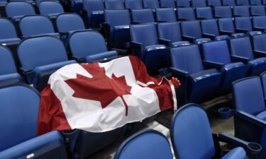 A Canadian flag sits on a pair of seats reserved for fans at a World Junior Championship hockey game in January 2018 in Buffalo