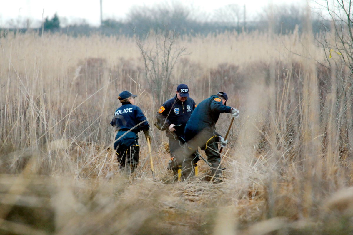 <i>Eduardo Munoz Alvarez/AP</i><br/>Law enforcement is seen here arriving at a house in July 2023