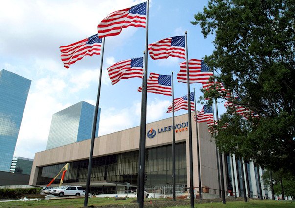 Flags fly in front of the Lakewood Church in Houston, June 28, 2005.