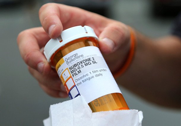 Newly-released inmate George Ballentine holds his prescription medicine Suboxone outside a pharmacy on July 23, 2018, in Greenfield, Mass. As the Oregon Legislature considers overhauling the state's pioneering drug decriminalization law, a bipartisan group of lawmakers are pushing for more funding for medications used to treat opioid addiction in jails.