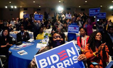 Attendees cheer as Biden speaks at a South Carolina Democratic Party event in Columbia on January 27