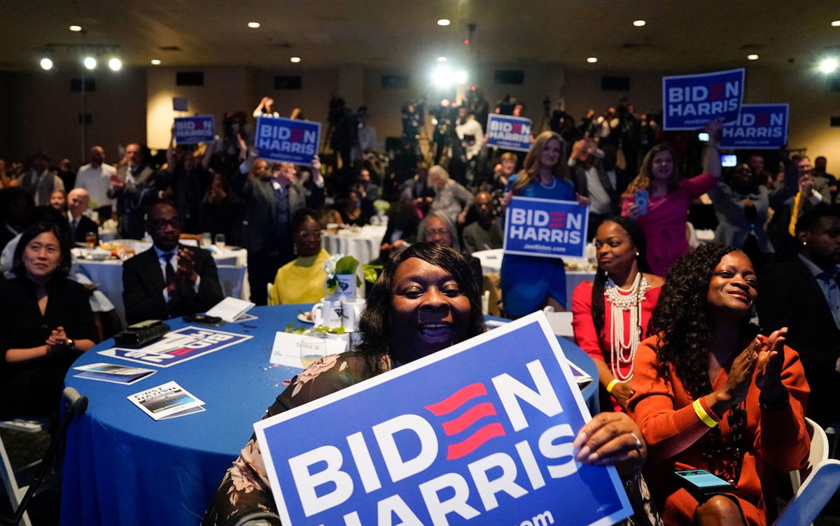 <i>Kent Nishimura/AFP/Getty Images</i><br/>Attendees cheer as Biden speaks at a South Carolina Democratic Party event in Columbia on January 27