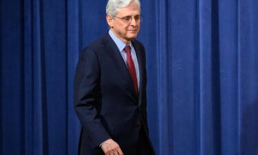 US Attorney General Merrick Garland arrives for a news conference at the Justice Department in Washington