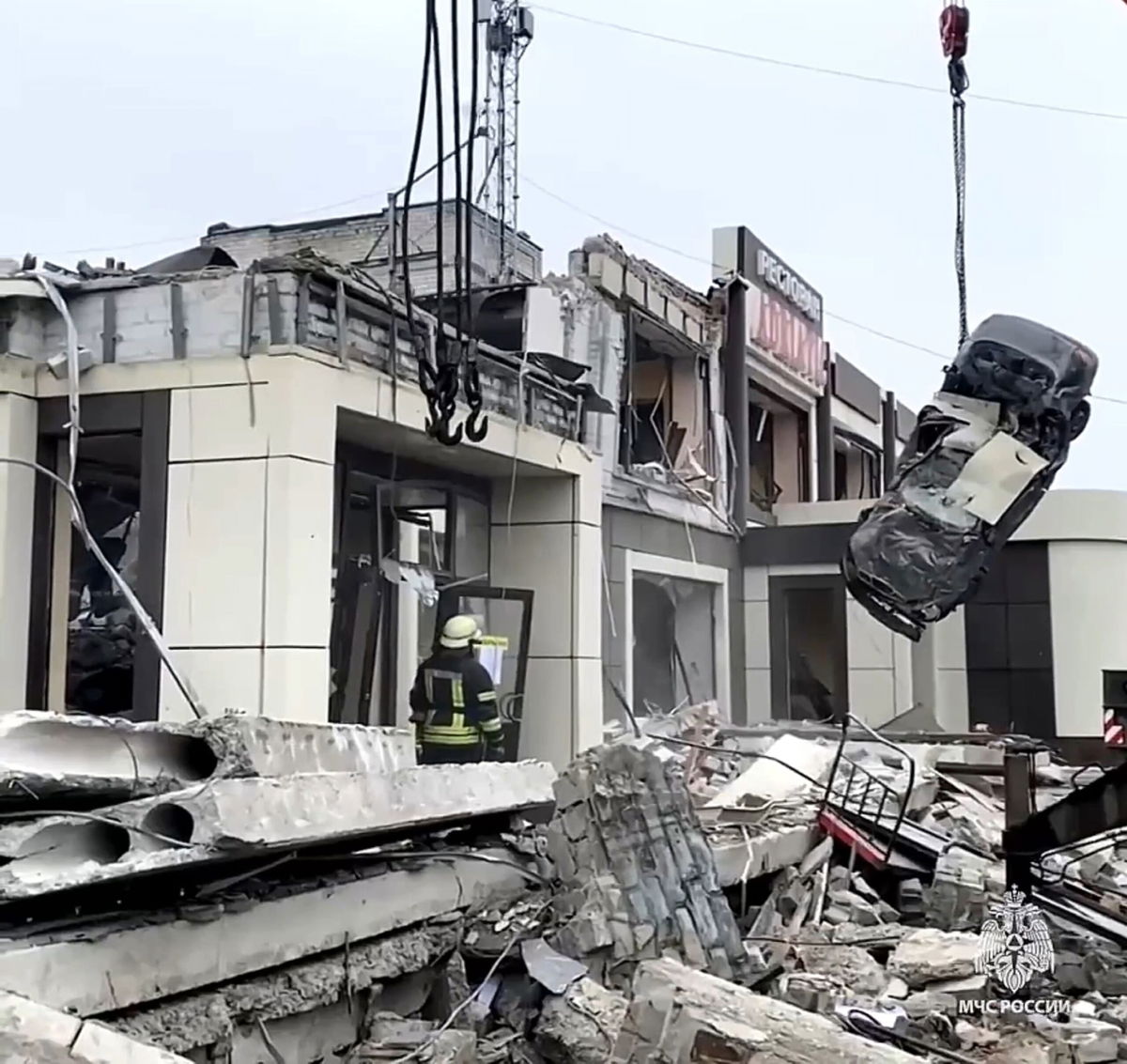 <i>Russian Emergency Ministry Press Service/AP</i><br/>Russian Emergency Ministry employees work at the side of a collapsed bakery in Lysychansk.