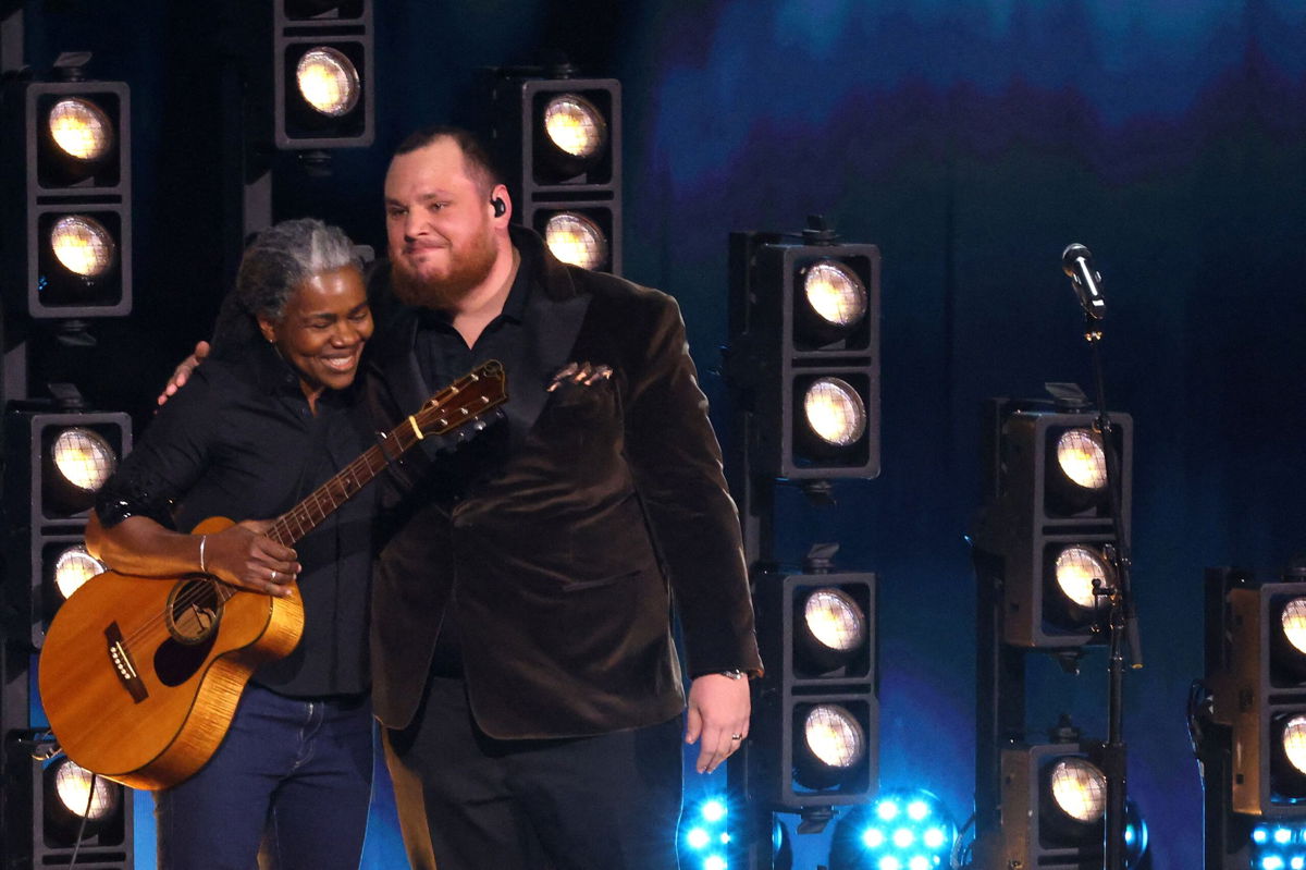<i>Mike Blake/Reuters</i><br/>(From left) Tracy Chapman and Luke Combs embrace after performing during the 2024 Grammy Awards in Los Angeles.