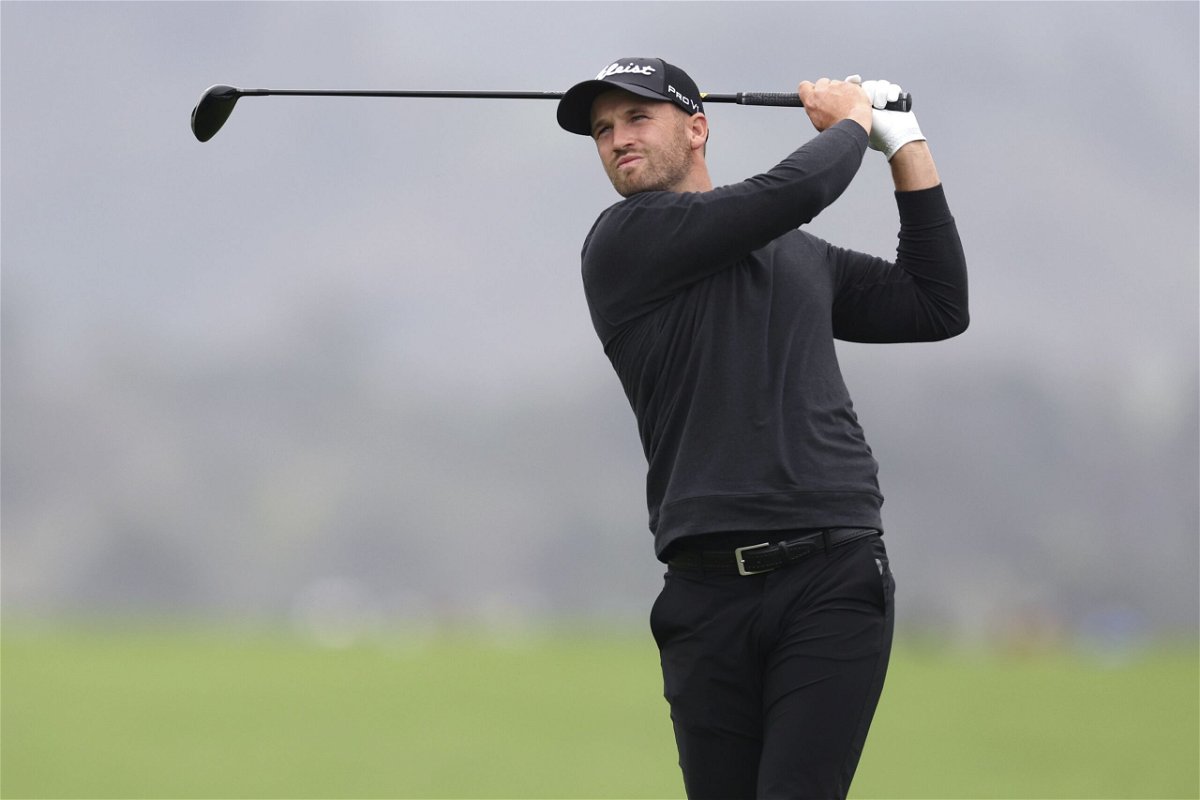 <i>Ezra Shaw/Getty Images</i><br/>Clark powered through wet conditions to post a historic round Saturday.