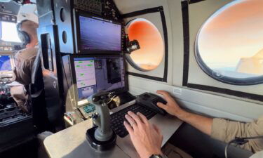 Cameras and radar are used on a plane flying over the Pacific looking for smugglers.