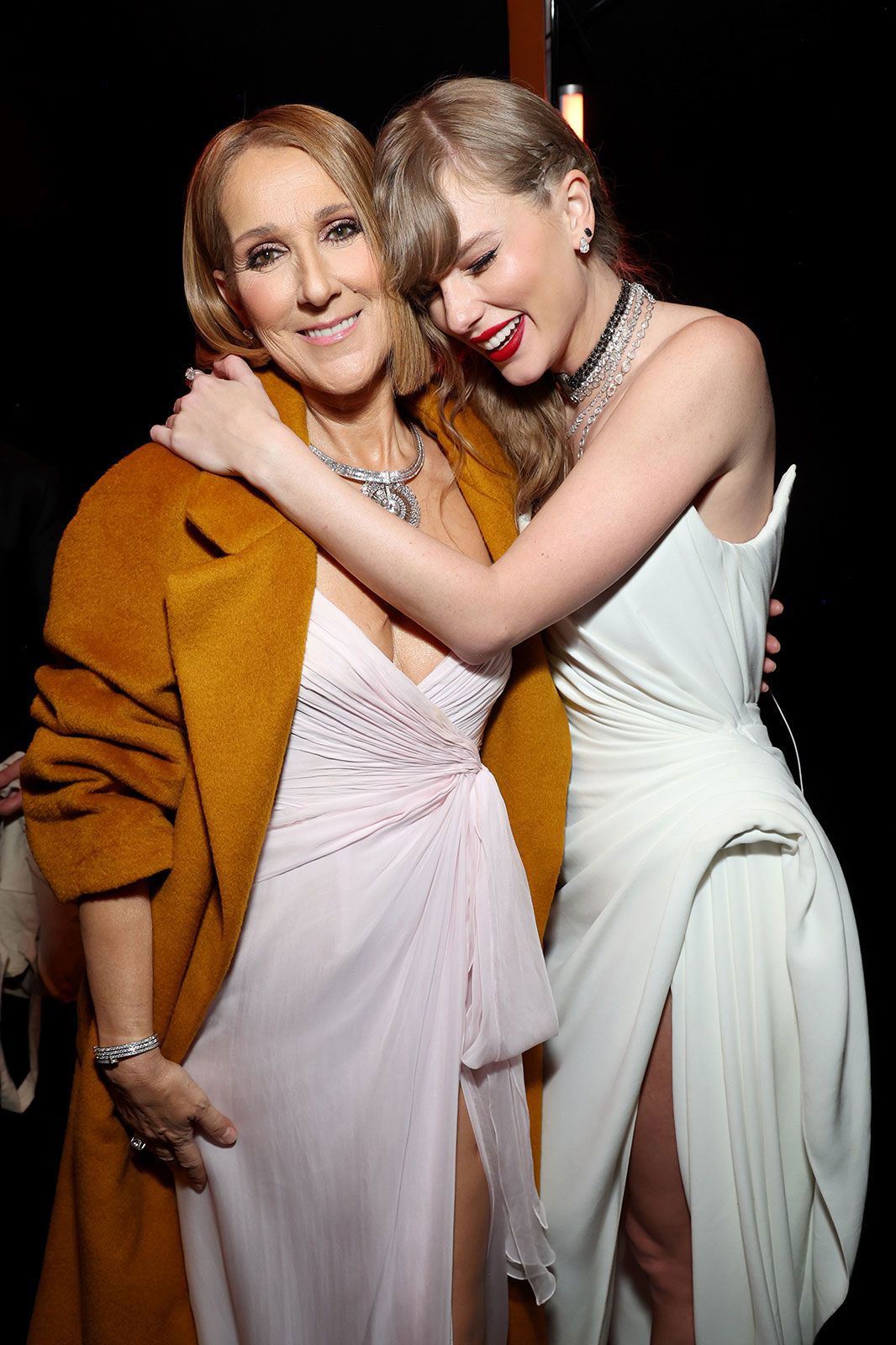 <i>Kevin Mazur/Getty Images for The Recording Academy</i><br/>Celine Dion and Taylor Swift embrace at the 66th GRAMMY Awards on February 4.