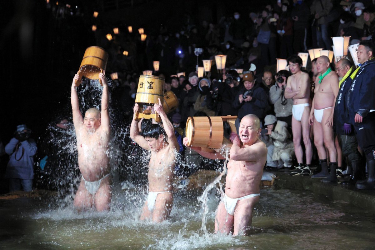 <i>The Asahi Shimbun/Getty Images</i><br/>Participants purify themselves with cold water on Yamauchigawa river during Somin-sai festival at Kokusekiji Temple in Iwate prefecture