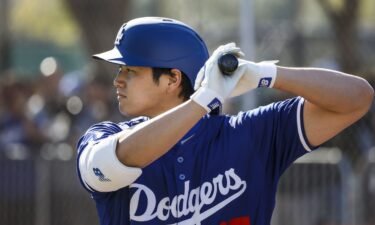Shohei Ohtani stands in the batter's box during a Los Angeles Dodgers Spring Training practice session.