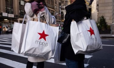 Shoppers carry Macy's bags during "Black Friday" in New York on November 24