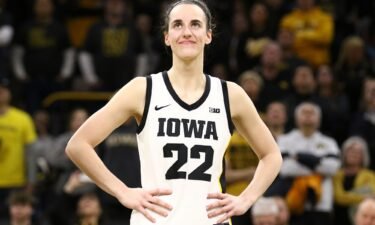 Caitlin Clark of the Iowa Hawkeyes listens as the crowd cheers after breaking the NCAA women's all-time scoring game last week.
