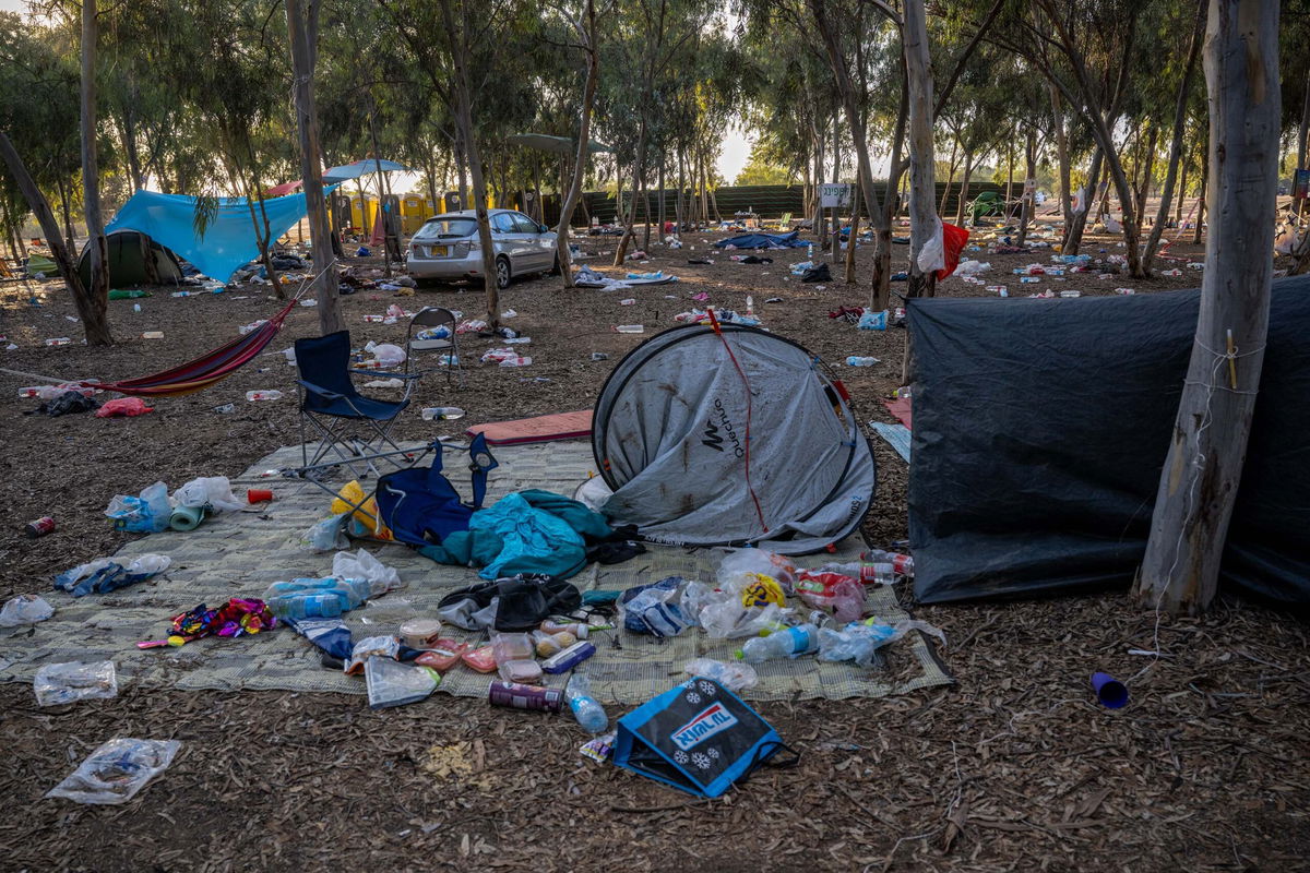 <i>Alexi J. Rosenfeld/Getty Images/File via CNN Newsource</i><br/>Destroyed cars and personal effects are seen scattered around the Nova music festival site on October 13