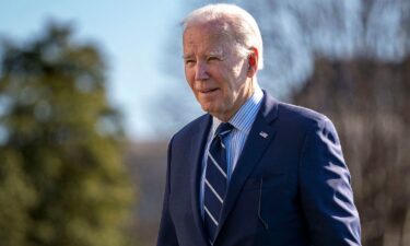 U.S. President Joe Biden walks across the South Lawn of the White House