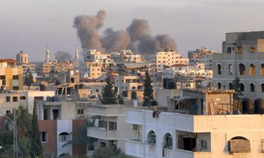 A picture taken in Gaza City shows smoke billowing in the background during Israeli bombardment on February 20