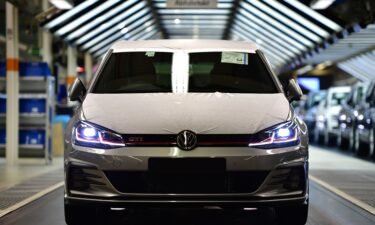 A Volkswagen Golf GTI leaves the assembly line at a Volkswagen factory in 2018.