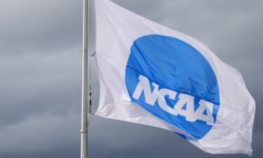 An NCAA logo flag is seen here in June 2021 at the NCAA Track and Field Championships at Hayward Field. A Tennessee judge has temporarily blocked the NCAA from enforcing parts of its interim policy for student-athletes.