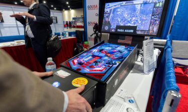 A January 6-themed pinball machine is played at the Conservative Political Action Conference at the National Harbor