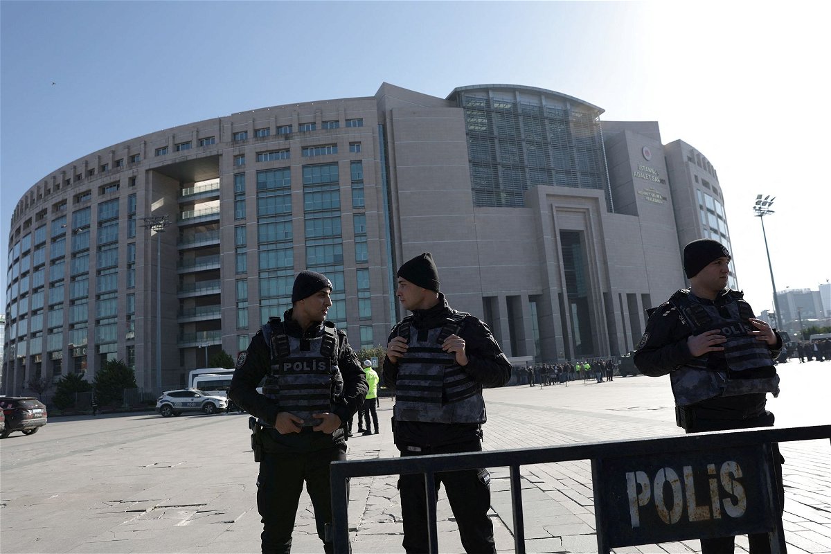 <i>Murad Sezer/Reuters</i><br/>Police officers stand guard outside the Caglayan courthouse after a shooting in Istanbul.